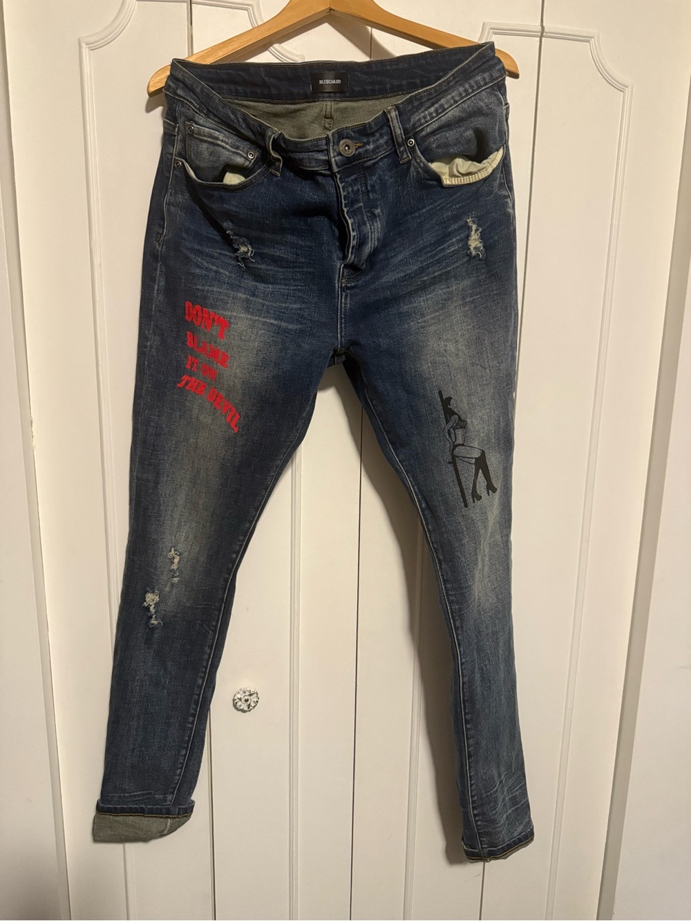 Dark Blue Denim Jeans with Visible Brand Tag